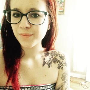 Syd Rose showing off her birthday tattoo.