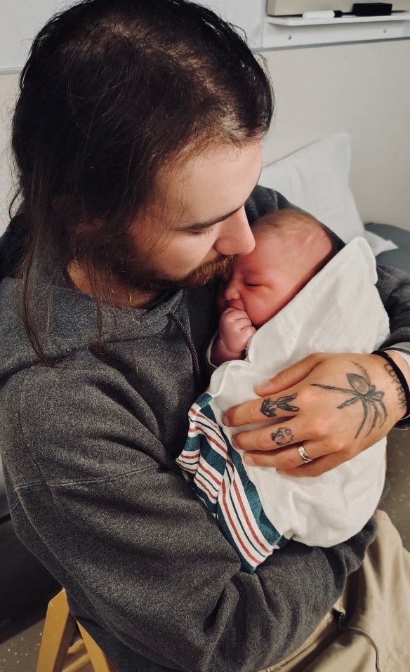 photo of Nicolas holding daughter Esther Rose